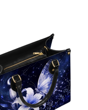 Nyctiris Leather Handbag